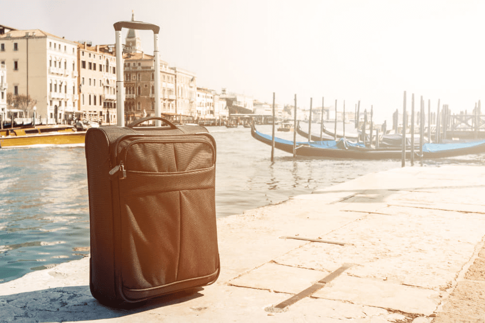 suitcase by the canal in Venice